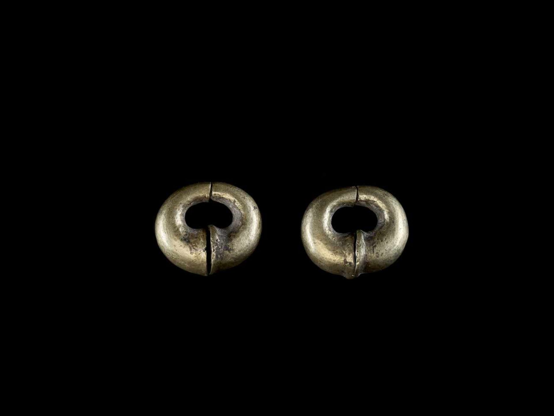 A PAIR OF GOLD EAR ORNAMENTS, ÓC EO CULTURE Óc Eo Culture, Mekong Delta, 3rd – 7th century. The