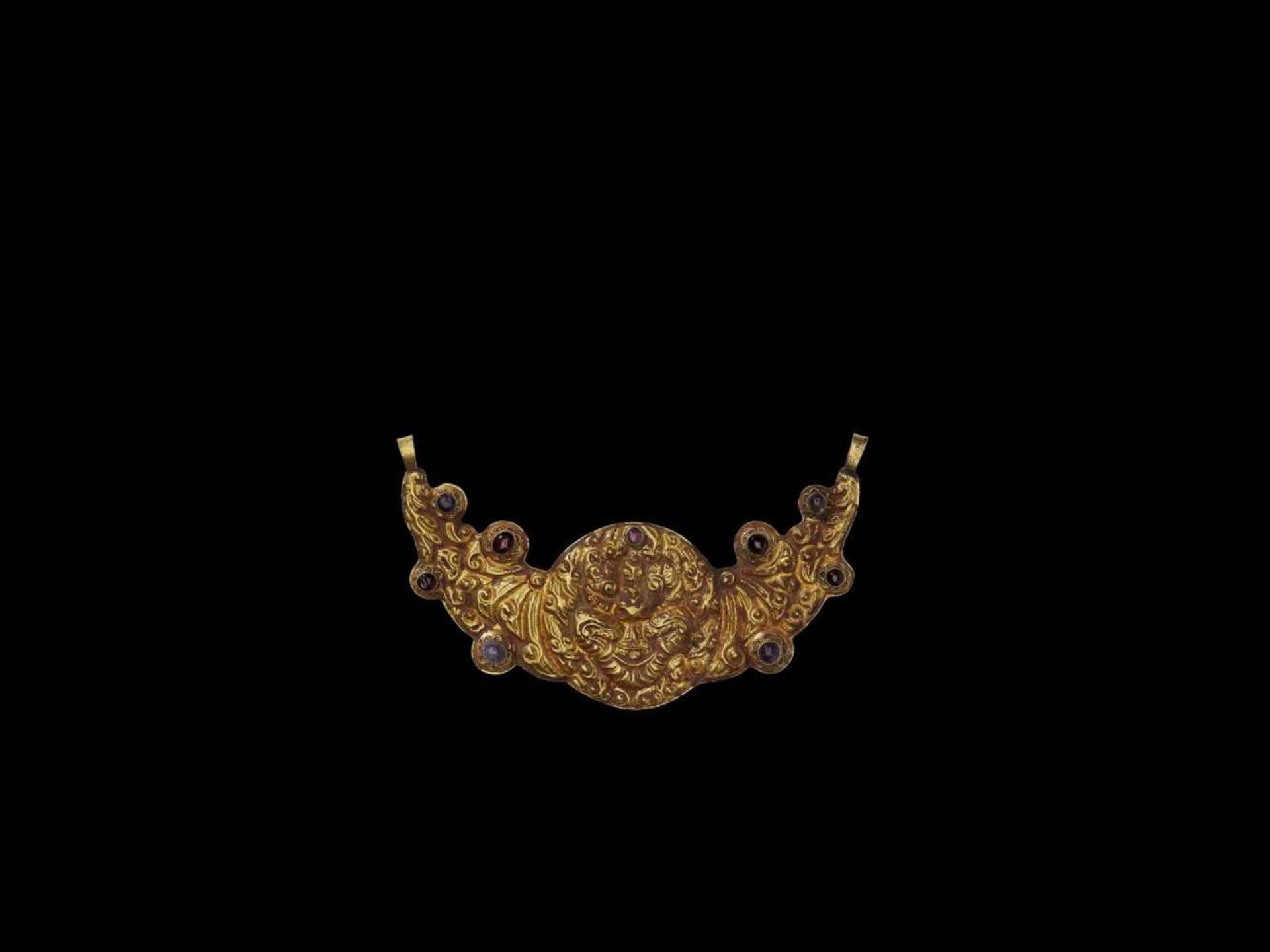 A CHAM REPOUSSÉ GOLD CRESCENT MOON PECTORAL DEPICTING KALA Central or southern Cham kingdom,