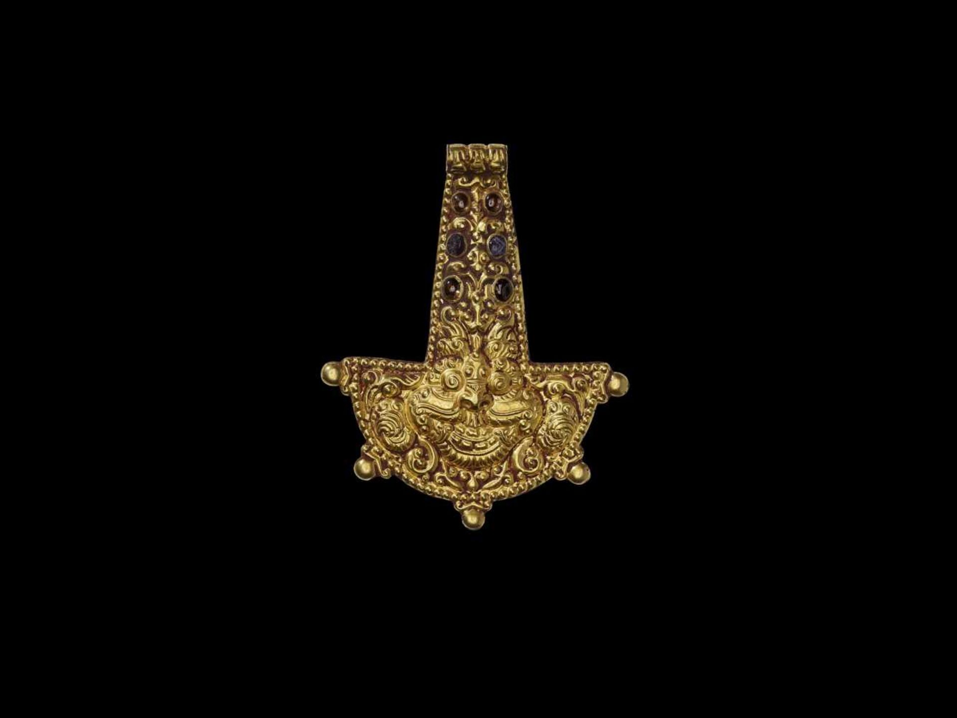 A CHAM GOLD PENDANT WITH HEAD OF KALA Central or southern Cham kingdom, Tra Kieu Style, 11th –