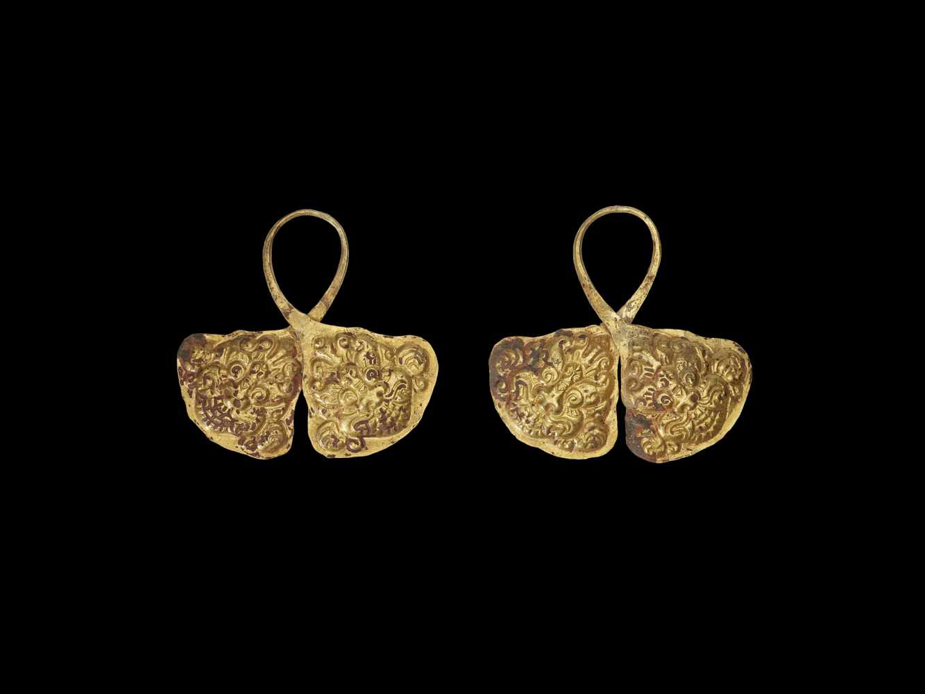 A PAIR OF CHAM REPOUSSÉ GOLD CROWN ORNAMENTS WITH GUARDIAN LIONS Champa, c. 8th – 9th century. The