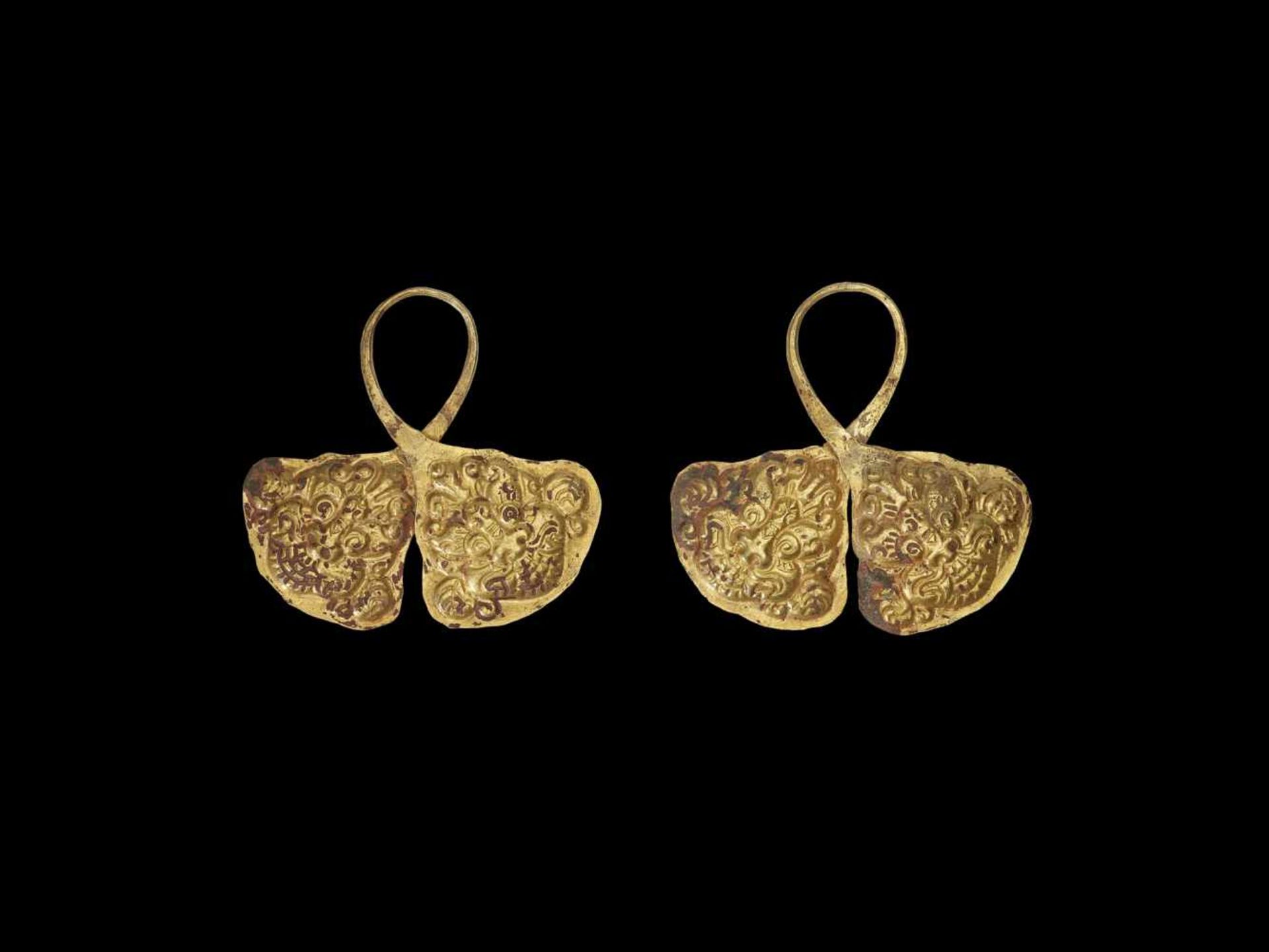 A PAIR OF CHAM REPOUSSÉ GOLD CROWN ORNAMENTS WITH GUARDIAN LIONS Champa, c. 8th – 9th century. The