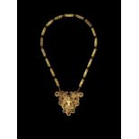 A CHAM REPOUSSÉ GOLD NECKLACE WITH A PECTORAL DEPICTING A SEATED HINDU DEITY Central or southern