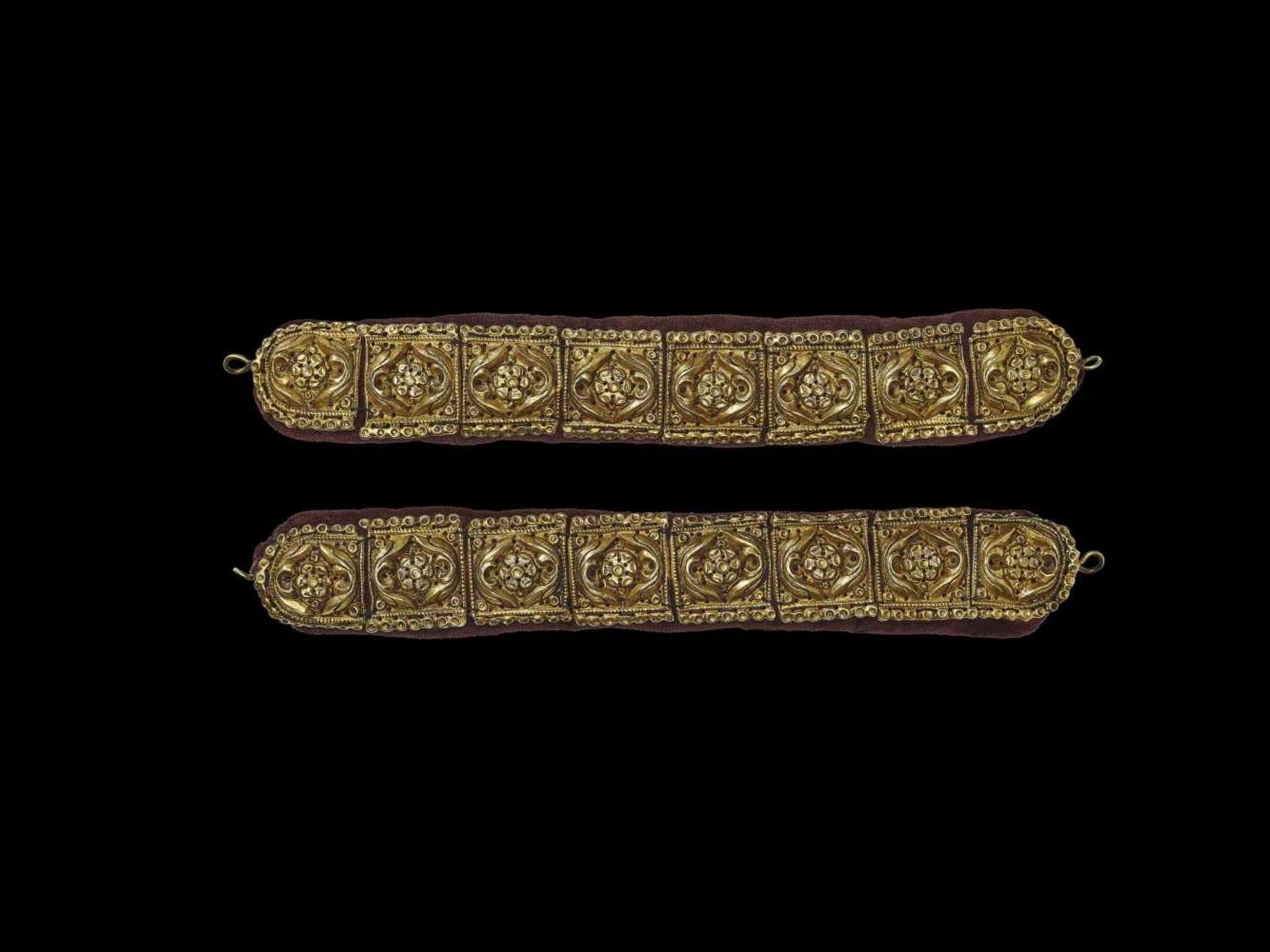 EIGHT CHAM REPOUSSE GOLD BELT ORNAMENTS Champa, c. 15th century. This lot contains eight square gold