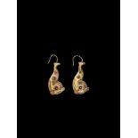 A PAIR OF CHAM REPOUSSÉ GOLD EAR ORNAMENTS Champa, c. 10th century. The earrings crafted in the form