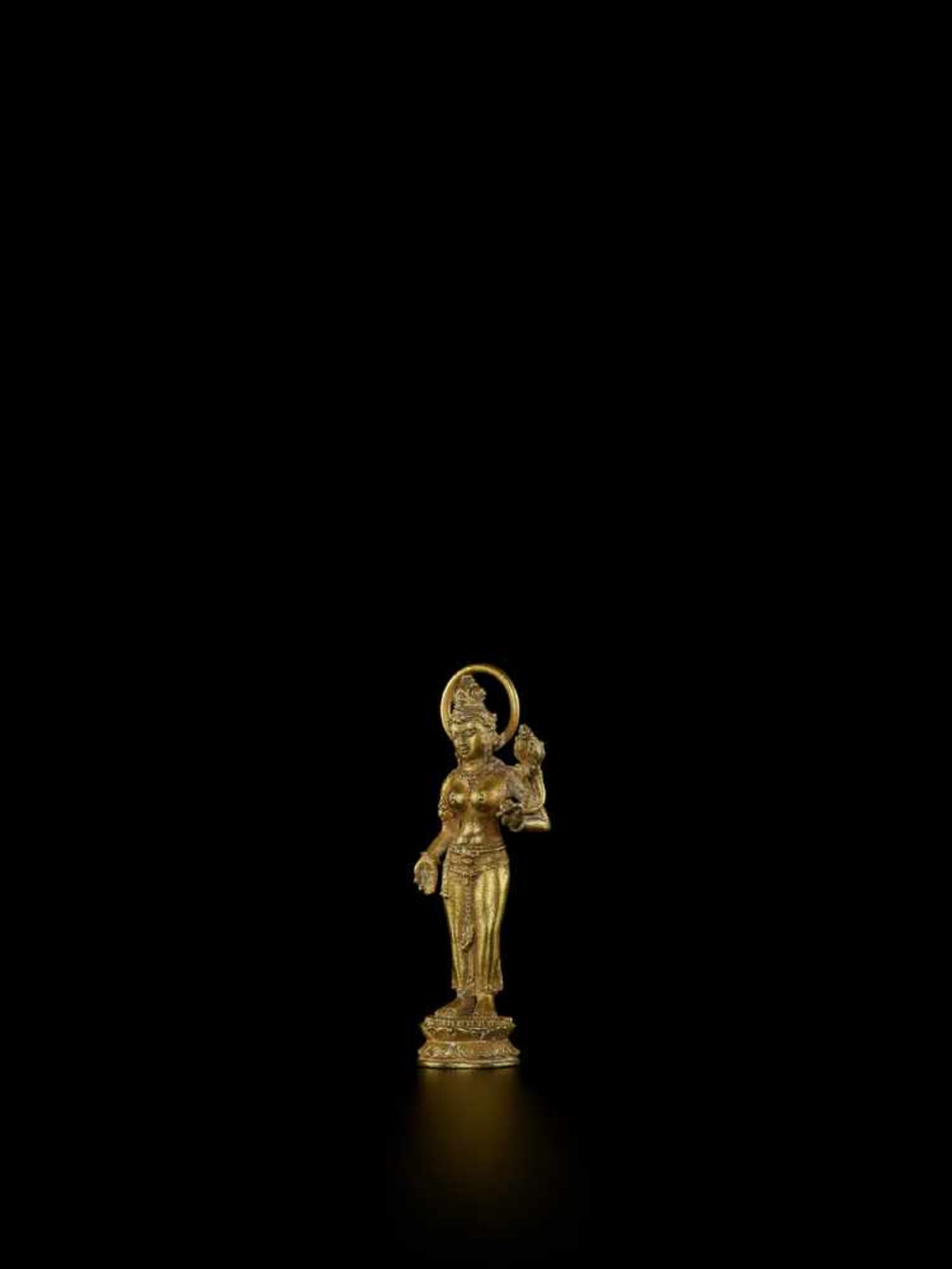 A JAVANESE GOLD FIGURE OF UMA Java, Indonesia, 20th century. The gold-cast figure of the non-Vedic