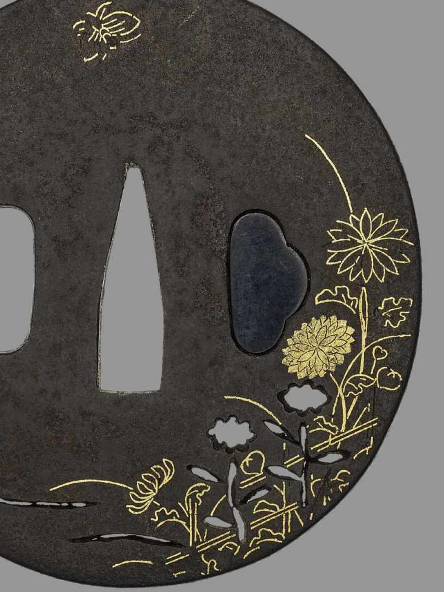 AN IRON TSUBA WITH FLOWERS AND NUNOME-ZOGAN Japan, 18th century, Edo period (1615-1868)The tsuba - Image 2 of 4