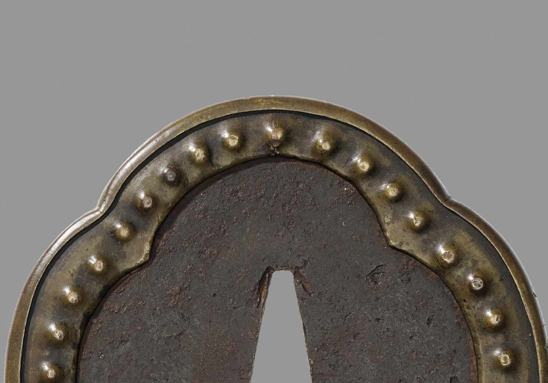 A RARE HIRATA SCHOOL TSUBA Japan, 17th/18th century, Edo period (1615-1868)The iron tsuba of - Image 2 of 4