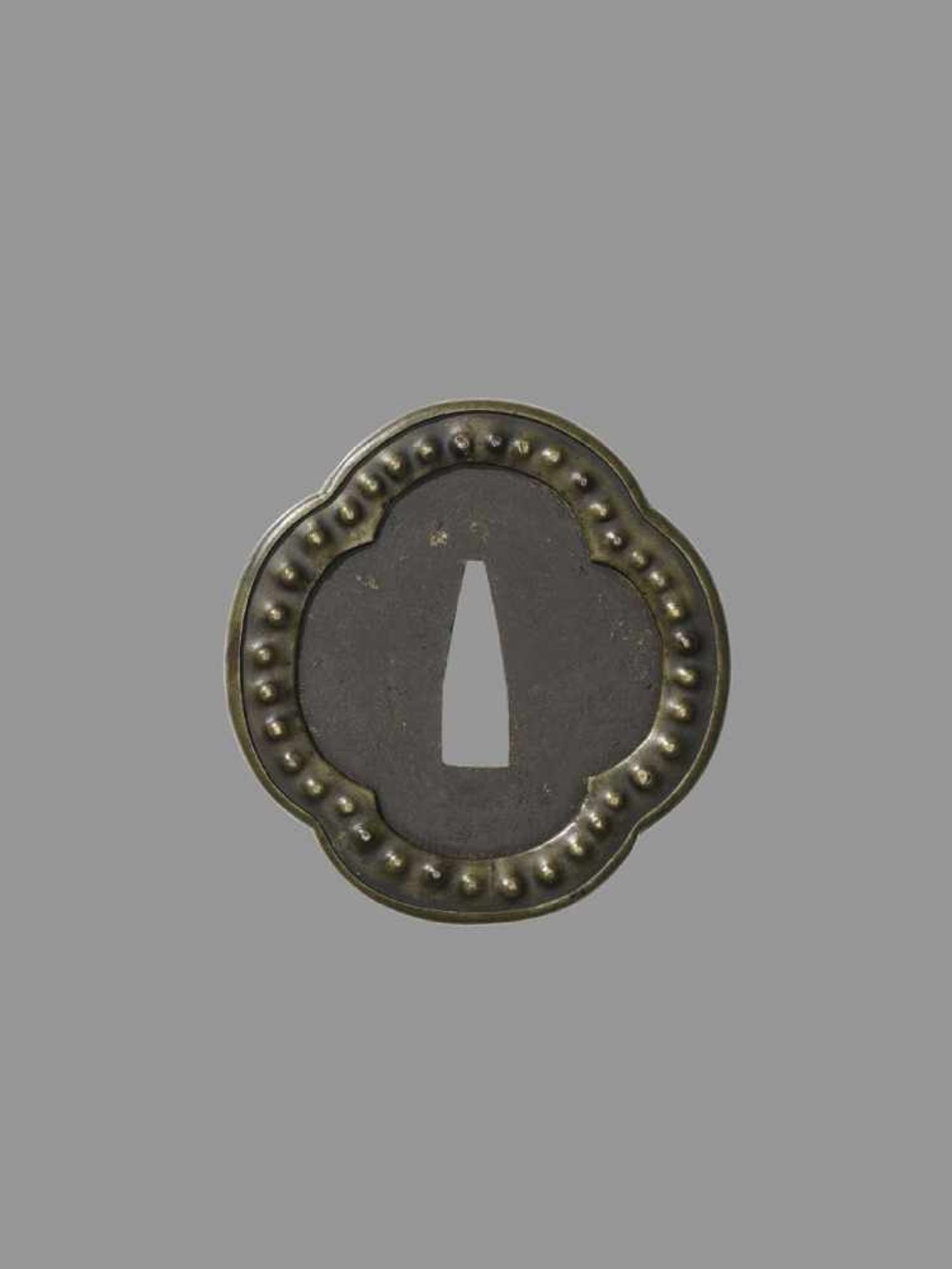 A RARE HIRATA SCHOOL TSUBA Japan, 17th/18th century, Edo period (1615-1868)The iron tsuba of - Image 3 of 4