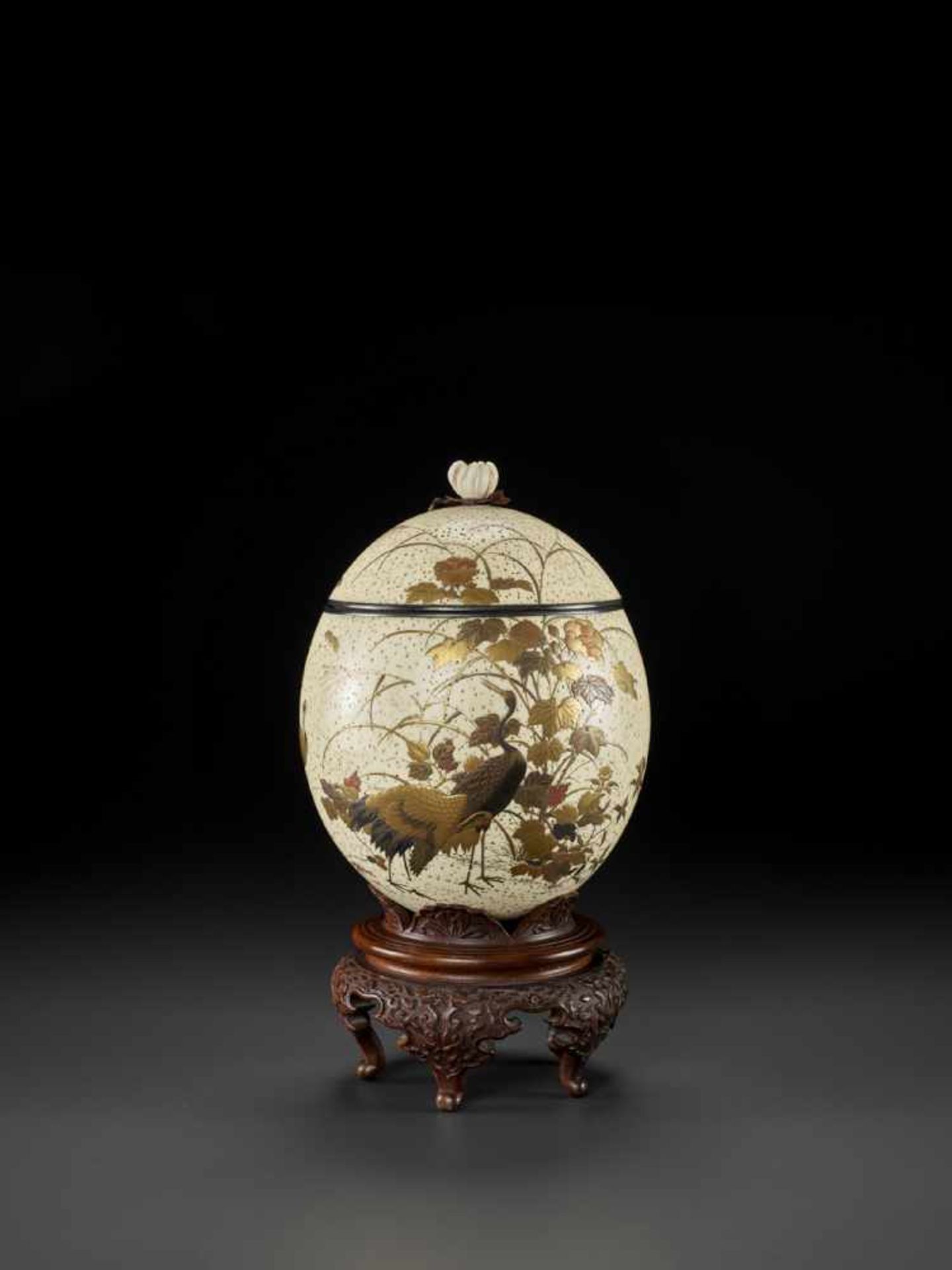 A FINELY LACQUERED OSTRICH EGG Japan, late 19th century, Meiji period (1868-1912)The speckled egg is