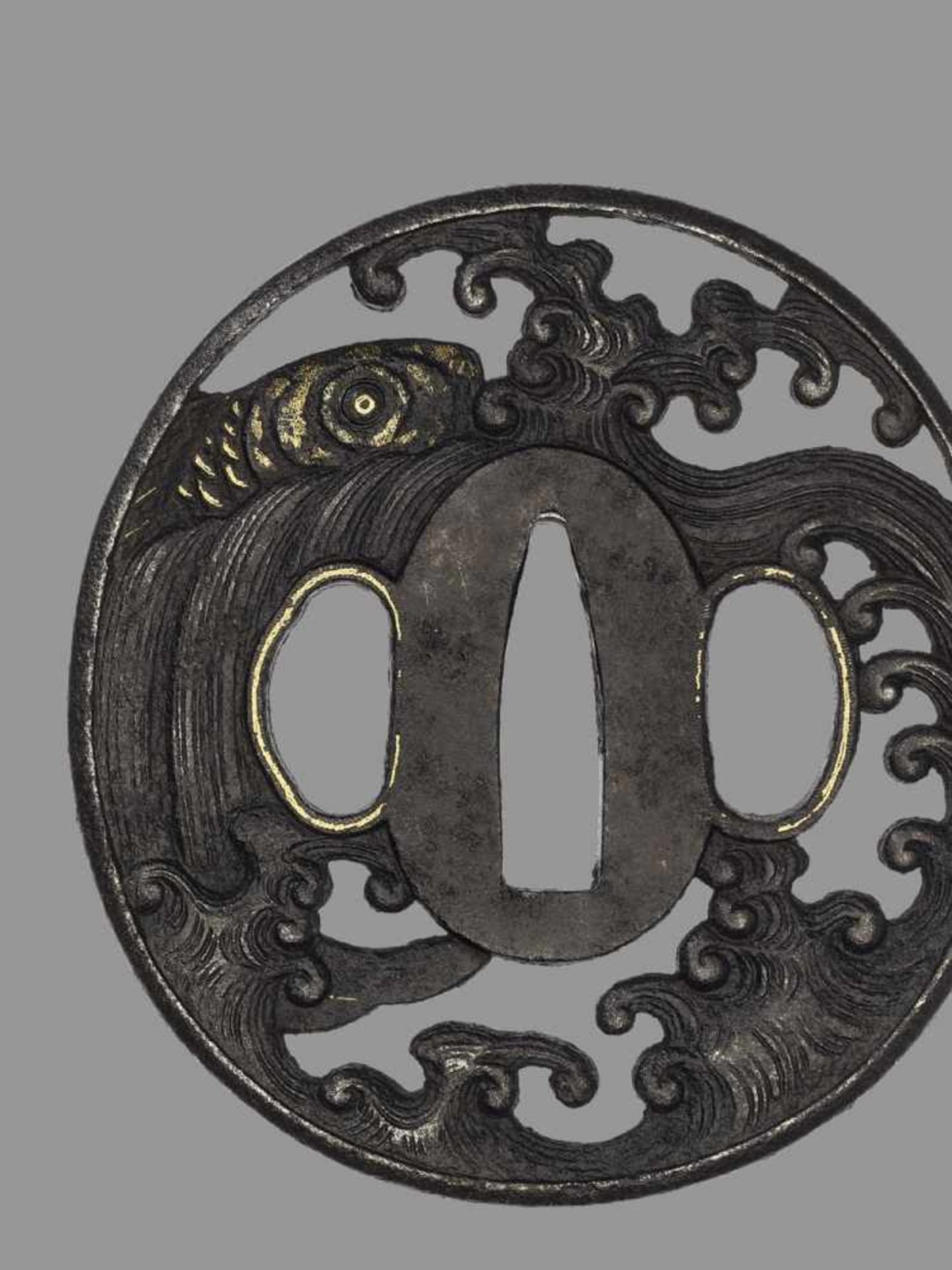 AN IRON TSUBA WITH CARP Japan, 18th century, Edo period (1615-1868)An iron tsuba of marugata shape - Image 2 of 4