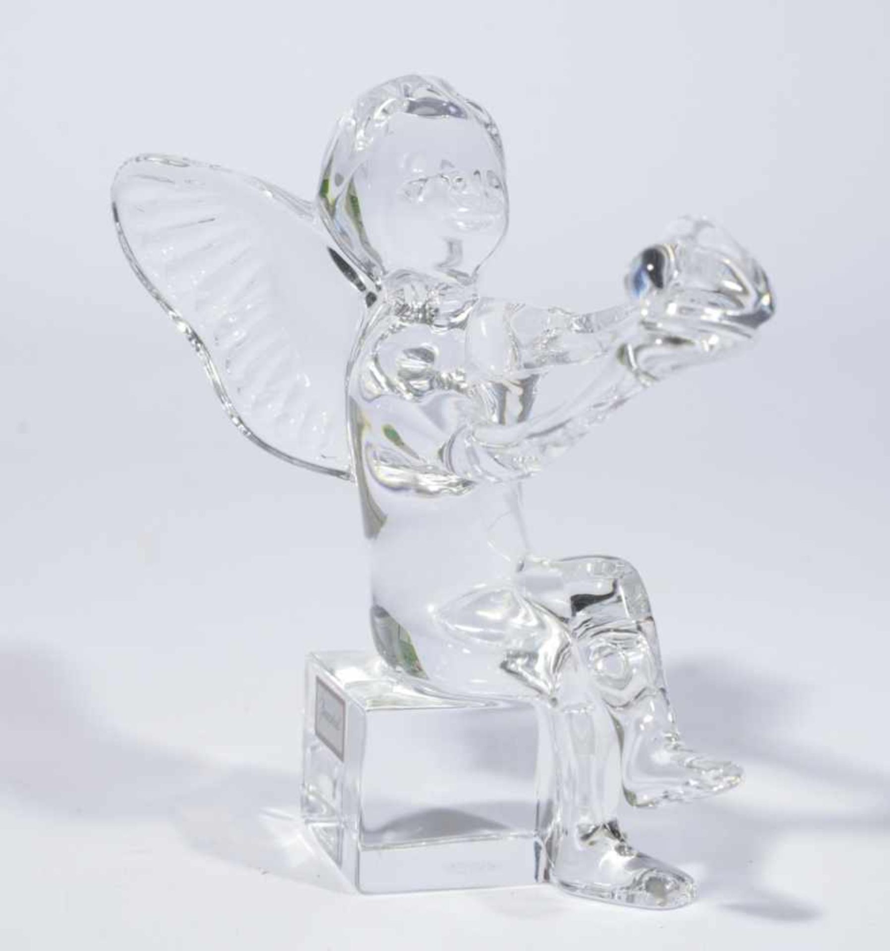 Cupid with heart in hands sitting on a pedestal, Baccarat France, Colourless crystal