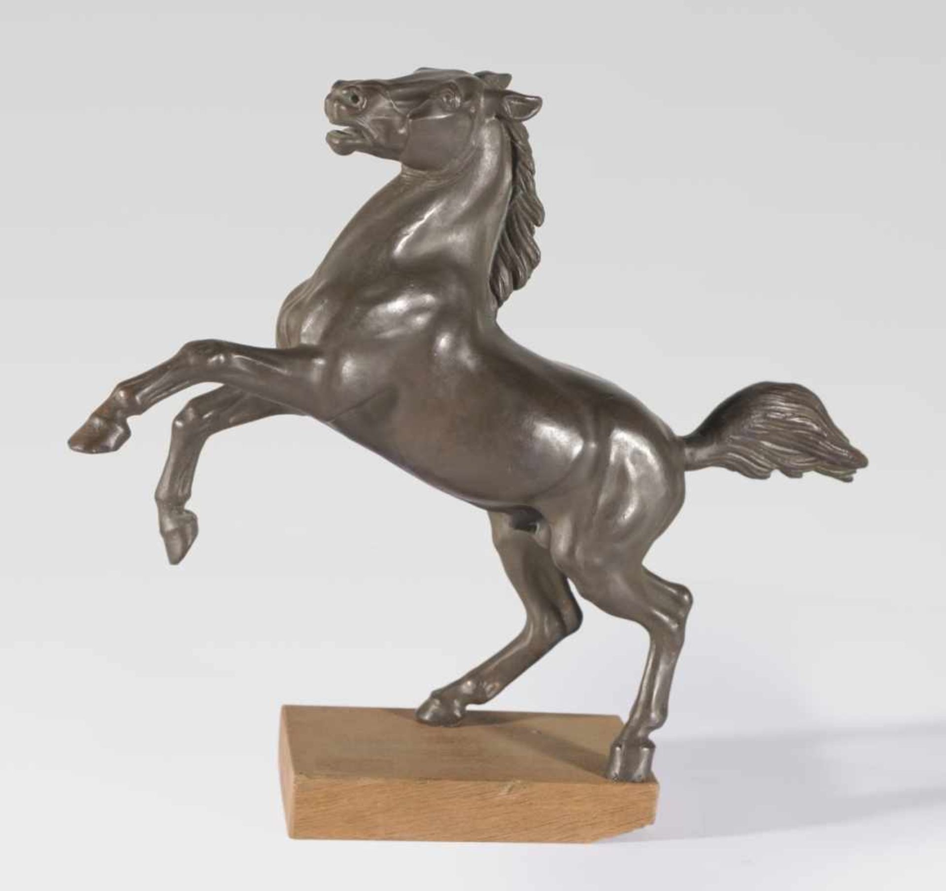 A rearing horse, Bronze, probably around 1900, 40 cm high (without the wooden pedestal),