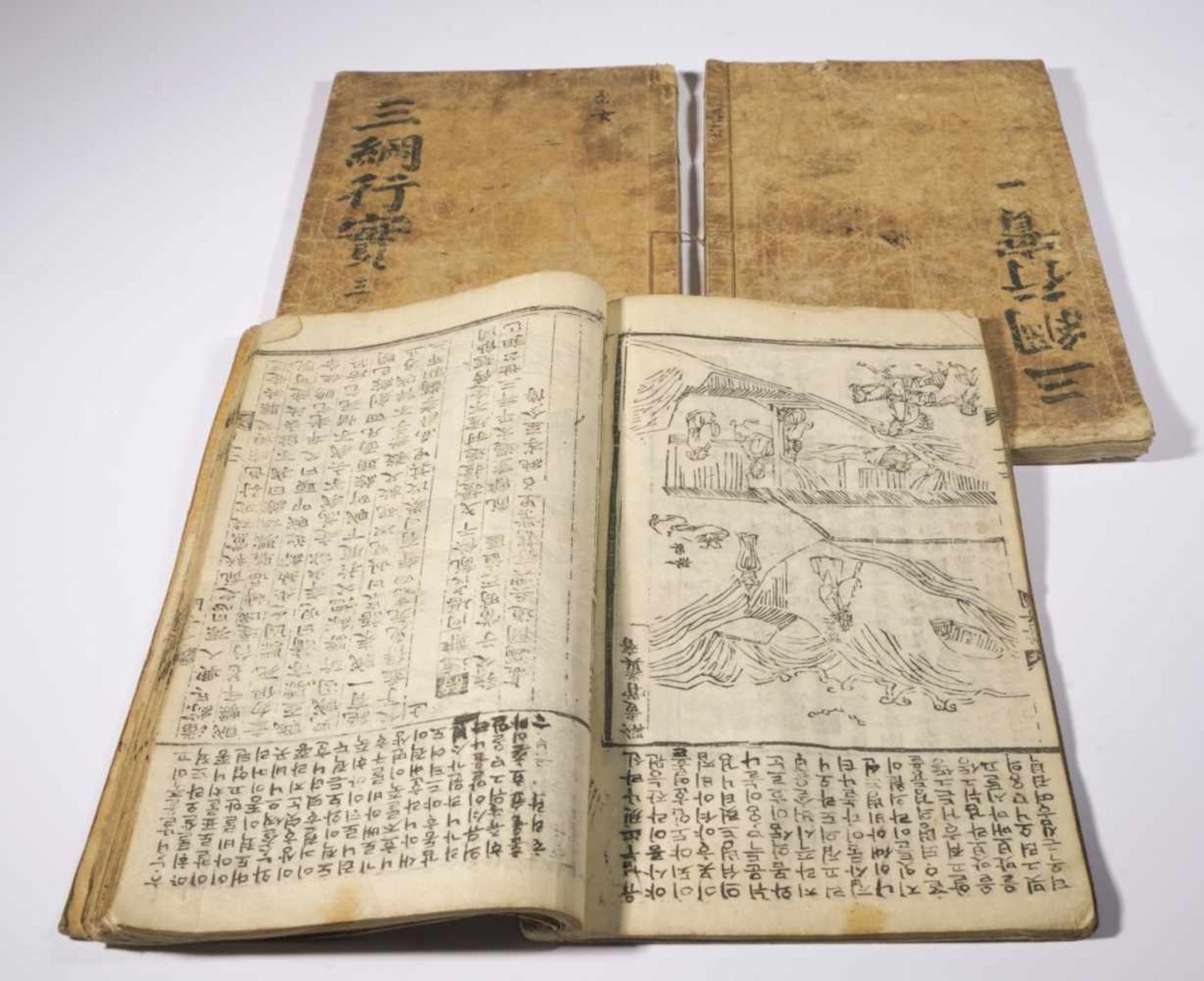 Three Korean (?) books with many illustrations, probably 19th c., each ca. 37 x 22 cm,