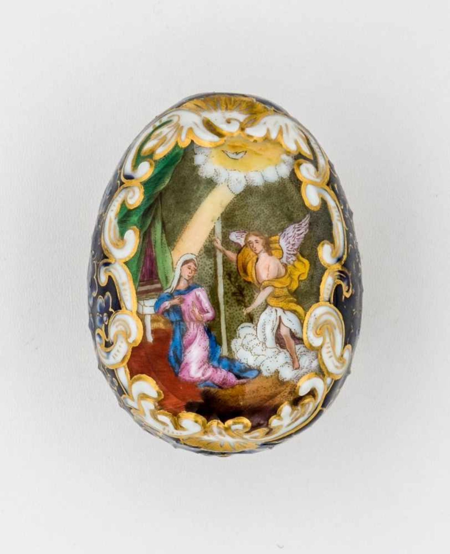 A Porcelain Easter egg with relief-like structure and depiction of the Annunciation andJesus crowned