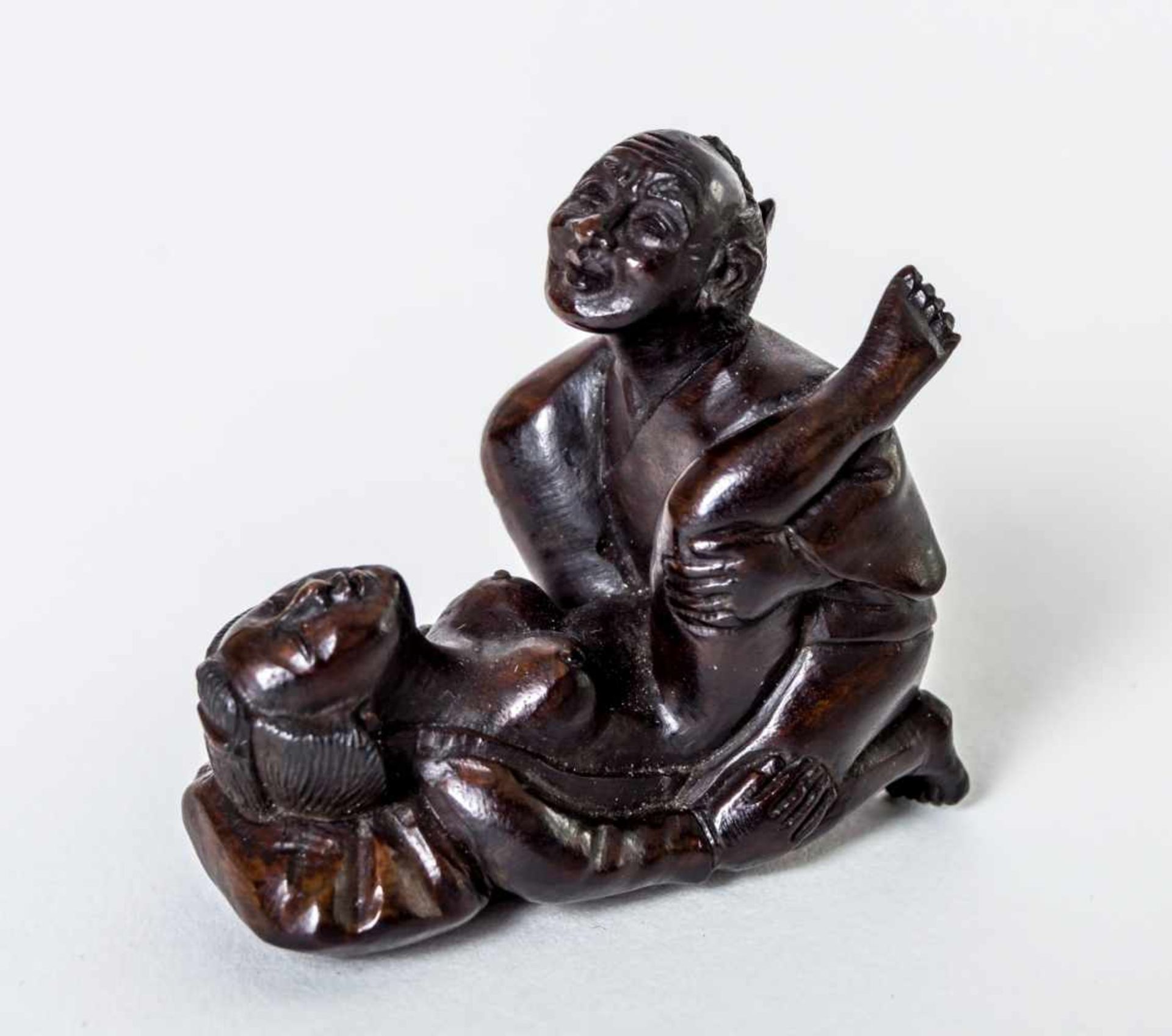 Netsuke with erotic scene, Japan, wood carving, probably around 1900, length: 4,2 cm,height: 4