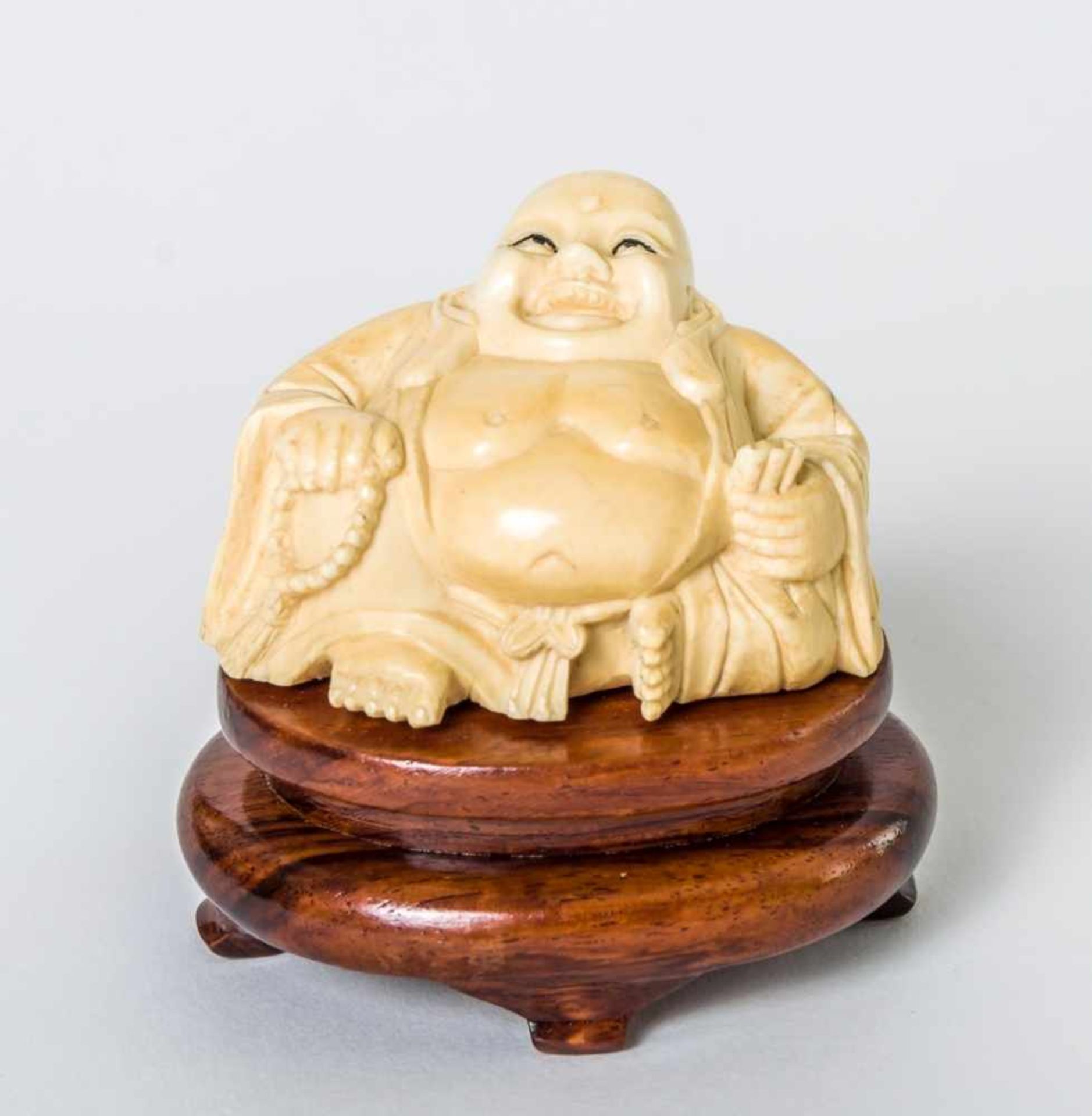 Budai, probably China, ivory carving on wooden base, 20th century, height: 4 cm, withbase: 6,8 cm //