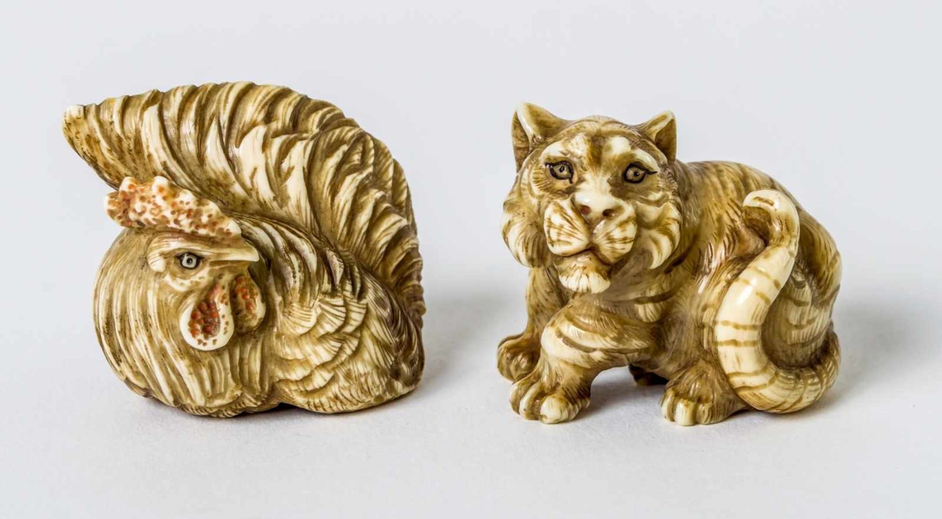 Two netsuke of a cock and a tiger, probably China, ivory carving, signed, probably around1900,