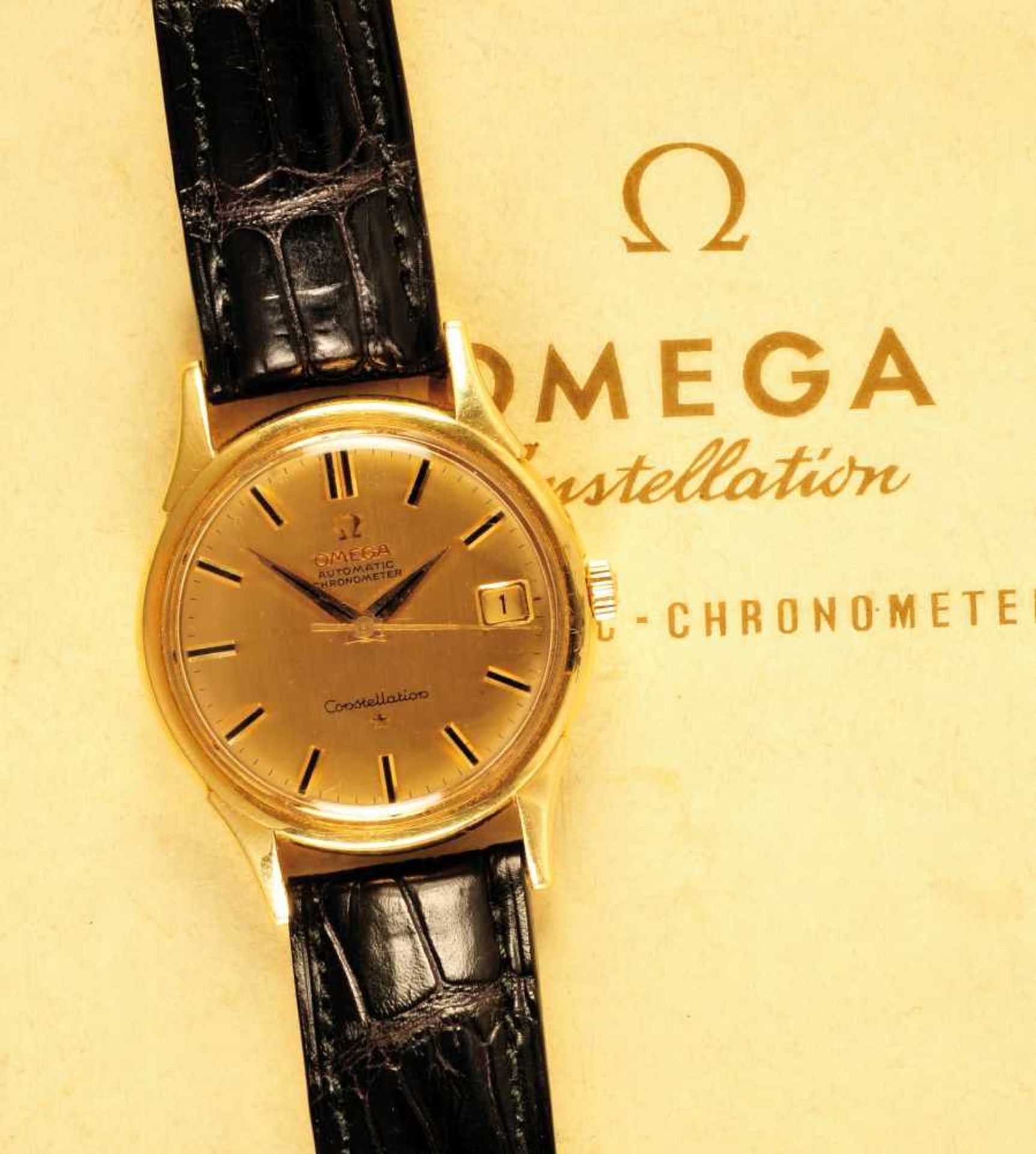 Golden wristwatch, Omega Constellation in selling case, with guarantee papersGoldarmbanduhr, Omega