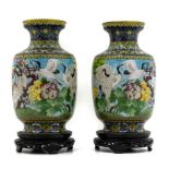 Pair of porcelain vases with bird decorations, China,, XX Century, con base. H cm 45