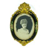 Oval frame in black and gold wood with decorations with water-colored photo of a girl, XIX