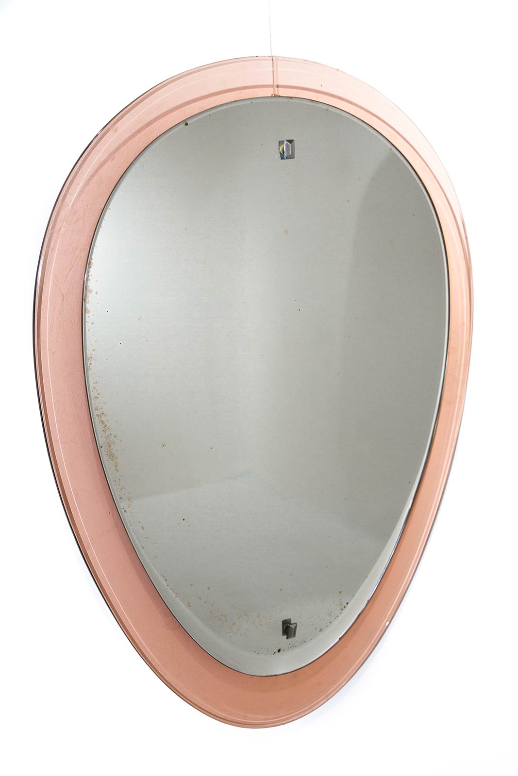 Cristal Art, from the 60s. Mirror with rose glass frame. H cm 79x56. Small silvering failing