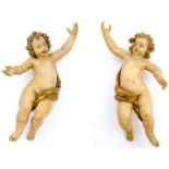 Pair of baroques puttis. Italy, 17th century. In lacquered and golden wood. H cm 72 , H cm 76