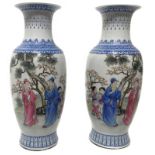 Pair of baluster vases decorated with lace in shades of blue depicting genre scene. On the back