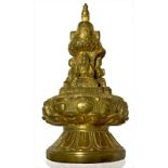 Sculpture in bronze gilded stupa. Rich decor with four small Buddha on lotus pedestal topped by a