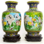 Pair of porcelain vases with bird decorations, China,, XX Century, con base. H cm 45