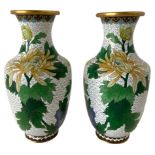 Couple pots enameled brass. White background with floral decorations leafy green. China, h 24 cm