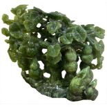 Weighty and outstanding jade sculpture, tree shaped, 19th century. Orient. With decorations on both