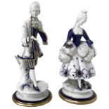 Pair of Capodimonte porcelain statuettes, 20th century. Ma'am and sir. H cm 24, cm 23. Minor