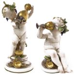 Pair of Capodimonte porcelain small puttis. Early 20th century. 9H cm 20, H Cm 29