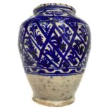 Persian glazed vase in blue colors. Nineteenth century. H 24 cm, max width 19