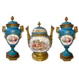 Triptych ceramic and gilded bronze, Old France, XIX century. Pair of vases with central potiche