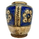 Persian glazed vase with floral decoration in blue color. Nineteenth century. H cm 17x14,5