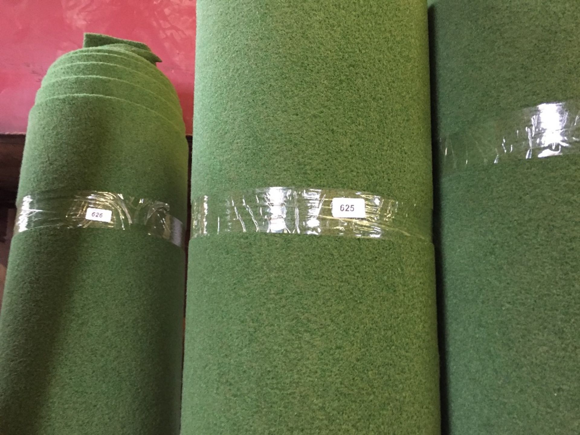 ROLLED UP GREEN CARPET