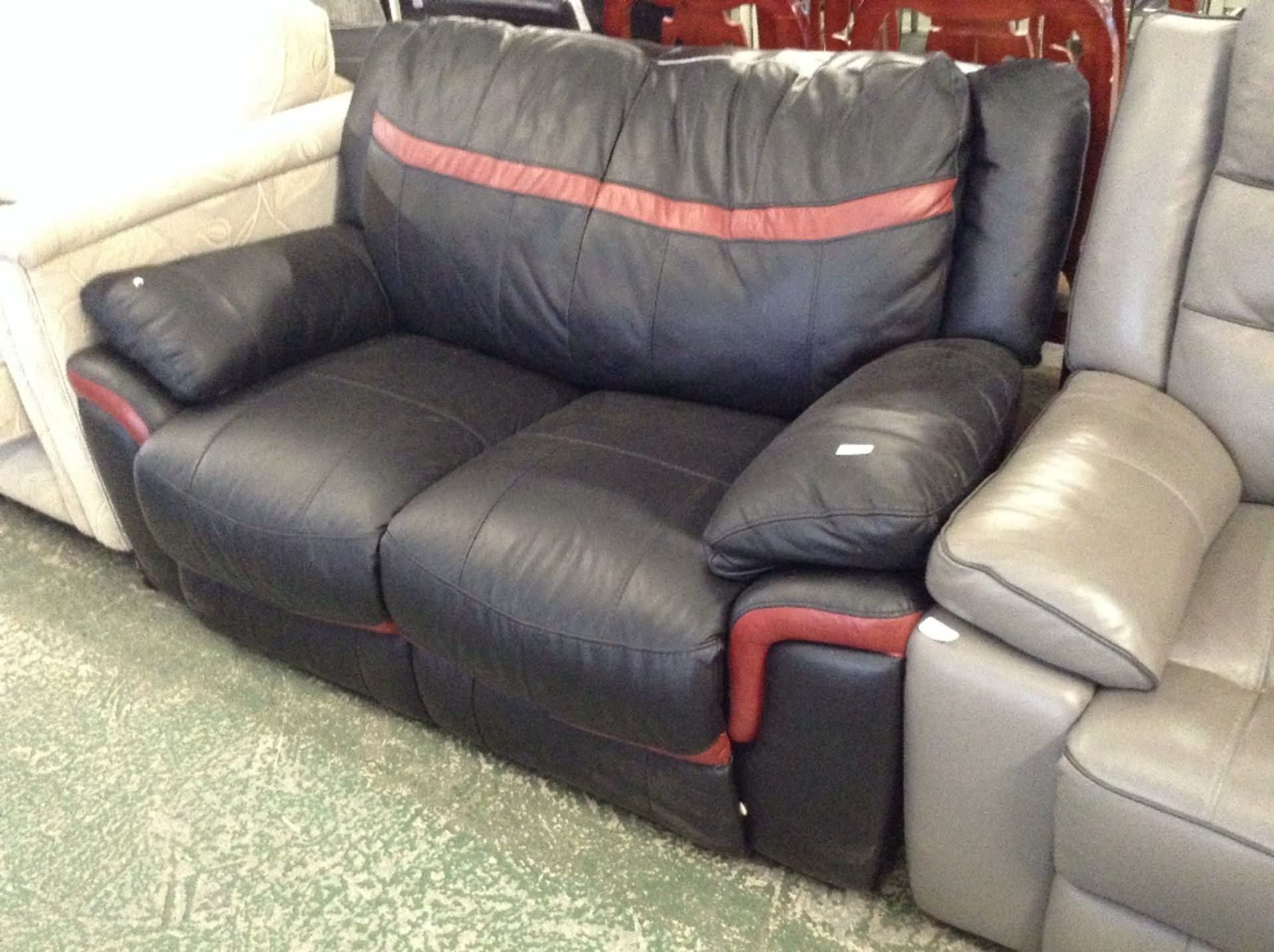 BLACK AND RED LEATHER 2 SEATER SOFA (TEAR ON BACK