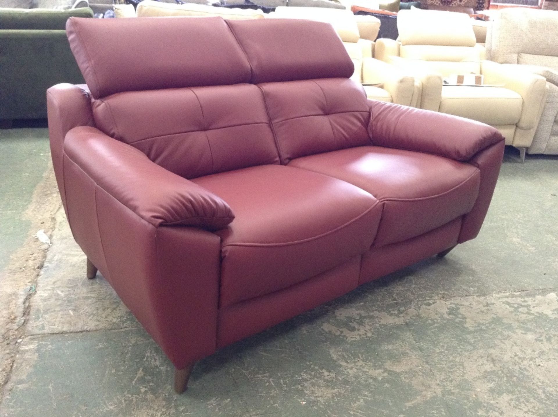 RED LEATHER 2 SEATER SOFA WITH ADJUSTABLE HEADREST