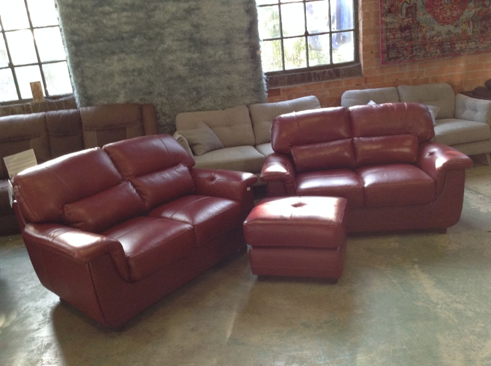 RED LEATHER 2 X 2 SEATER SOFAS AND FOOTSTOOL (WM58