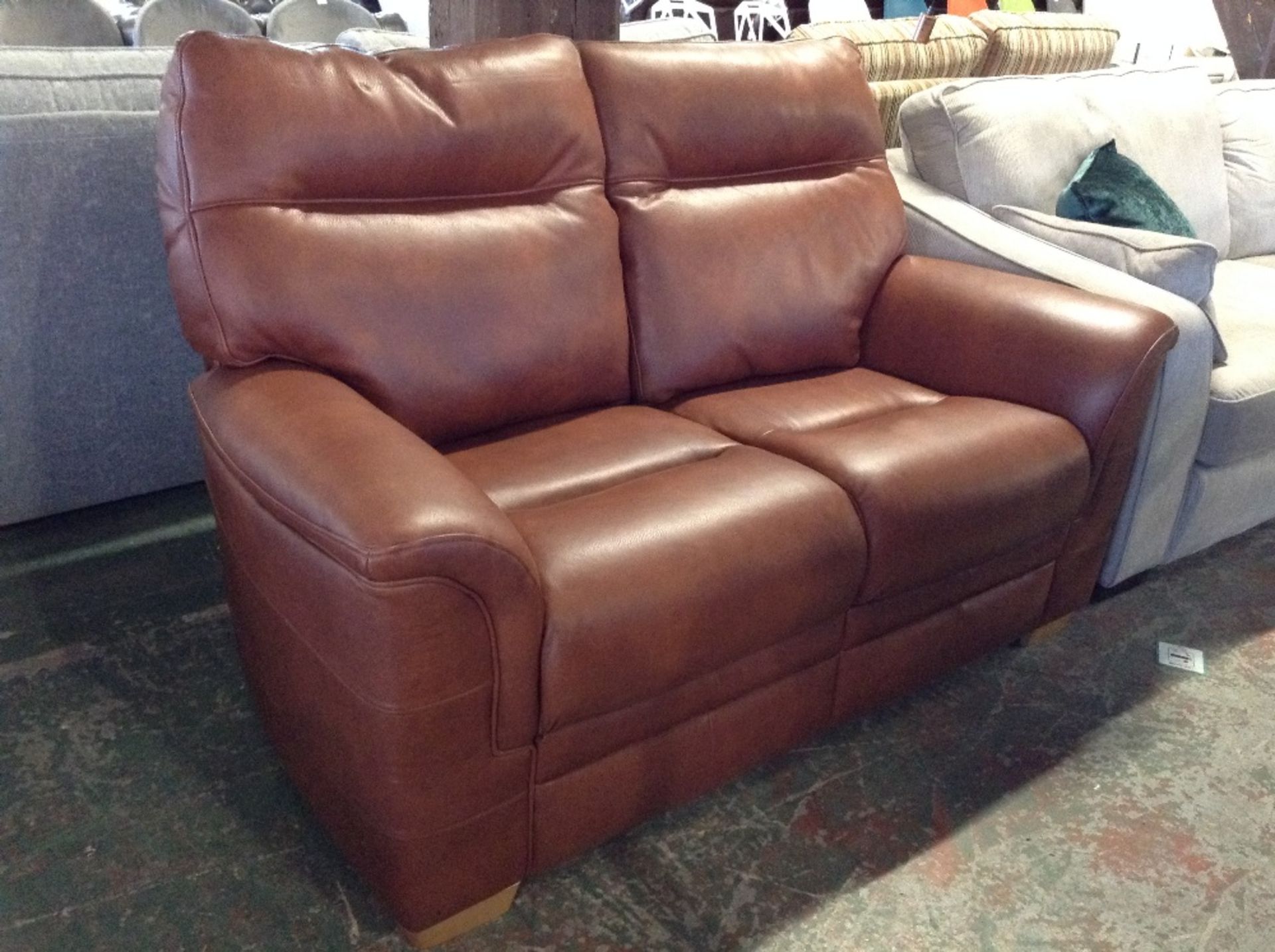 BROWN LEATHER HIGH BACK 2 SEATER SOFA (FAULTY BASE