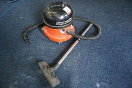 Numatic Vacuum Cleaner with Attachment as Lotted (Incomplete pipework and fittings). (Lot Located in
