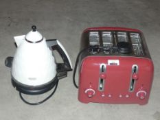 Lot to Contain 2 Assorted Items a Dualit Stainless Steel Red 4 Slice Toaster DeLonghi 1.5 Litre
