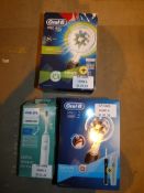 Lot to Contain Boxed 3 Assorted Electric Toothbrushes Oral B Pro 2 Oral Pro 650 Philips Sonicare