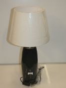 Black And Silver Rim Designer Table Lamp With Cream Fabric Shade From A High-End Lighting Company (