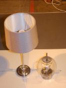 Assorted Boxed And Unboxed Lighting Items To Include A Stainless Steel And Glass Table Lamp And