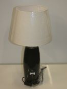 Black And Silver Rim Designer Table Lamp With Cream Fabric Shade From A High-End Lighting Company (