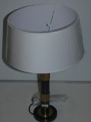 Black And Gold Designer Table Lamp With Oversized White Shades From A High-End Lighting Company (