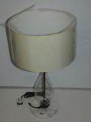 Clear Glass Base Beige Fabric Shade Designer Table Lamp From A High-End Lighting Company (Chelsom)