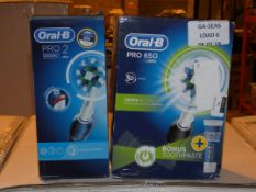 Lot to Contain 2 Boxed Assorted Items To Include Toothbrush and an Oral B Toothbrush